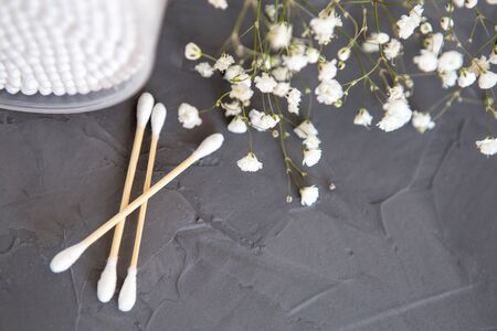 Bamboo cotton sticks for medicine, cosmetics, ear cleaning on a gray background. Concept of an eco-friendly lifestyle. Toning. Selective focus.の写真素材