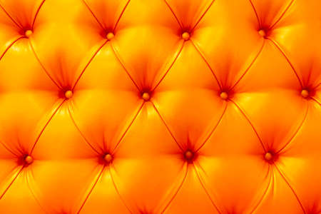 Buttoned golden texture of the leather upholstery. Background, texture conceptの写真素材