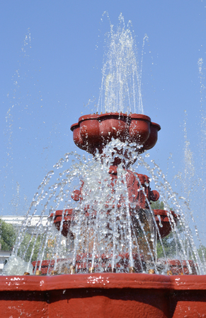 Fountain on blue sky background.の写真素材