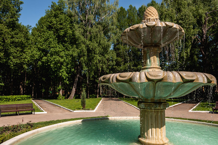 Fountain in the park on a background of the birchesの写真素材