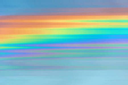 Colorful abstract decorative background with stripes in the colors of the rainbow. Can be used as wallpaper.の写真素材