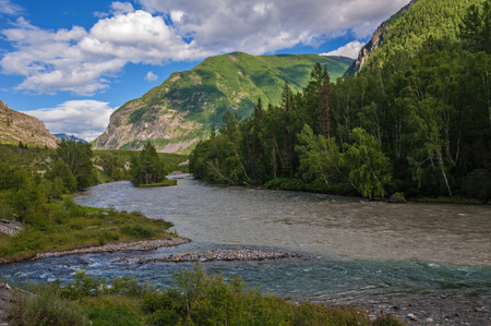 Confluence of two rivers in the mountains.の写真素材
