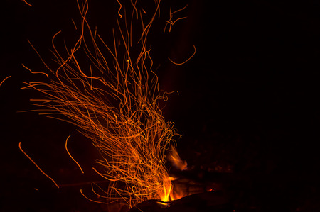 Sparks and flames from a bonfireの写真素材