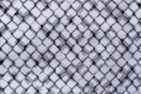 Abstract decorative background with blurred pattern of interwoven light and dark lines forming...
