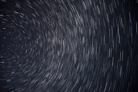 Abstract decorative background with traces of stars against the night sky, shot long exposure.