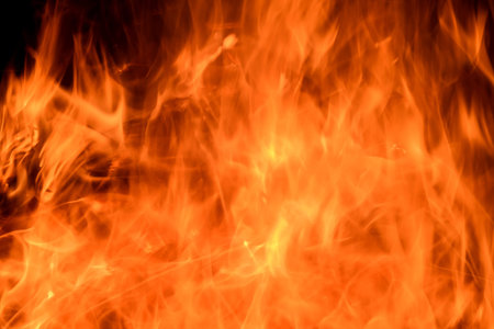 Abstract fiery background of red, yellow and orange flames of a bonfire