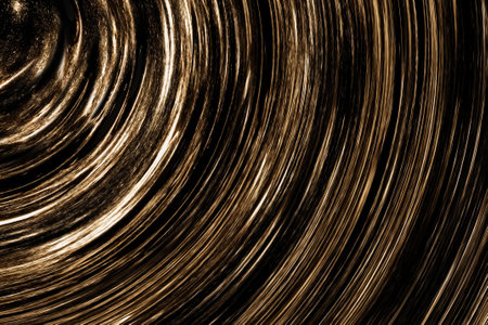 Abstract festive decorative background with a pattern of circles of golden and black color. Can be used as wallpaperの写真素材