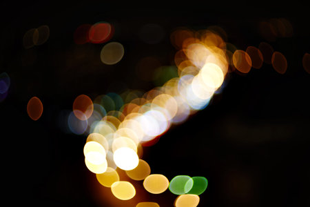 natural lens blurred color bokeh on dark nightlife of city background