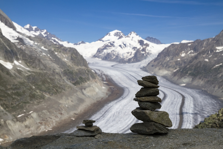 concept for hiking, mountaineering, walks and open adventures mountain peak with pyramids above the Aletsch Switzerland glacierの写真素材