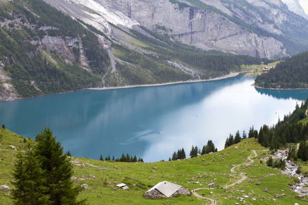 Amazing view of the Swiss Alps by Lake Oshchinsense Oshchinen, in the Bernese Oberland, Switzerlandの写真素材