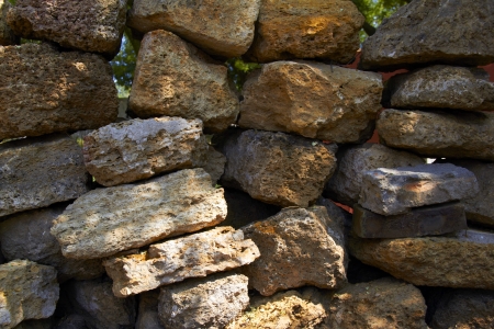 wall of a large rough stoneの写真素材
