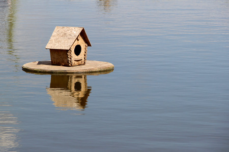 Duck house on the lake. photoの写真素材