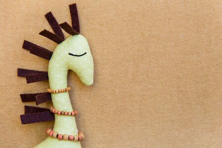 big background with one textile giraffes. Photoの写真素材