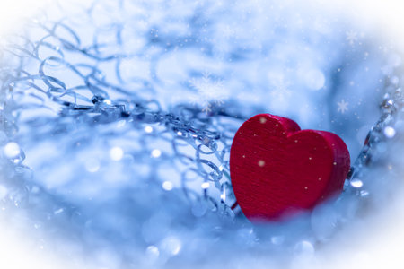 Red heart in silver chains. Background for valentine's day.の写真素材