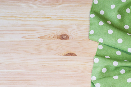Tablecloth with polka dots on a wooden table. Horizontal.の写真素材