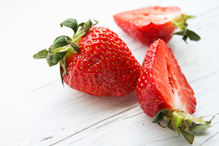 Fresh strawberries on a white wooden background. Summer background.の写真素材