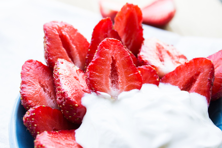 Strawberries with sour cream. Close-up. Selective focus.の写真素材