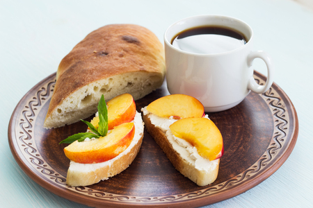 Coffee and sandwiches with cream cheese. Breakfast.の写真素材