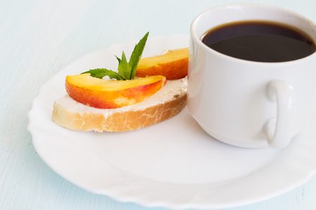 Breakfast. Coffee and sandwiches with cream cheese on a light background.の写真素材