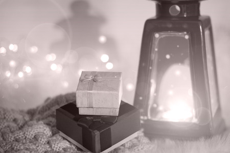 The concept of Christmas and New Year. Cozy home winter background. A Christmas gift in a cozy atmosphere. Copy space. Image in chocolate colors.の写真素材