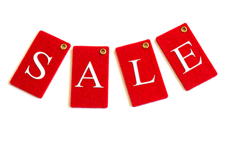 Red sale tags or labels, isolated on white background. Copy space. Close-up.の写真素材
