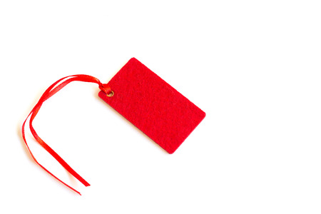 Red tag or label isolated on white background. Copy space.の写真素材