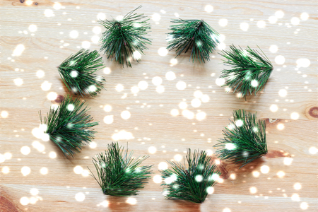 Christmas wreath on wooden background. Christmas wreath in minimalist style. Copy space. Top view.の写真素材