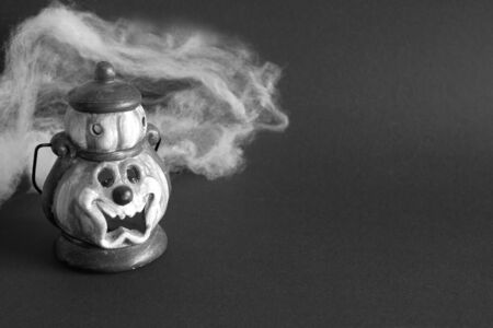 Colorful halloween background. Halloween celebration concept with flashlight, pumpkin and cobweb. Place for text.Black and white image.の写真素材