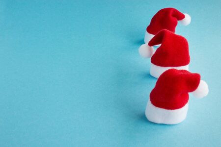 Â  Santa hat on a blue background. Christmas and New Year holiday background. Place for text.の写真素材