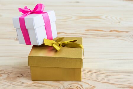 Gift boxes on a natural wooden background. The concept of gifts for the holidays. Place for text.の写真素材
