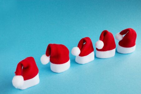 Â  Santa hat on a blue background. Christmas and New Year holiday background. Place for text.の写真素材