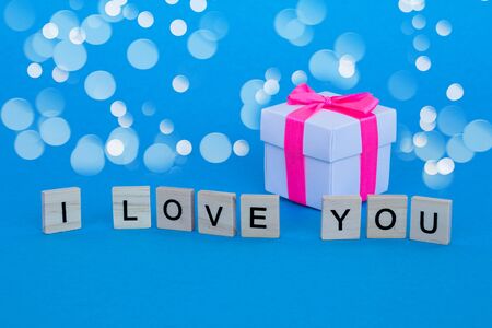 Gift box and text i love you. The concept of romantic relationship. Lovely postcard for Valentine's Day.の写真素材