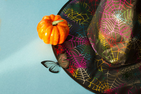 Magic hat and pumpkin on a light