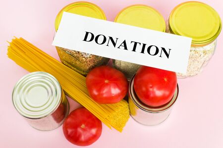 Stock of products at the time of quarantine. Jars of rice, buckwheat, canned goods, tomatoes, pasta. Help with the delivery of products. Donation. Quarantine, isolation, coronavirus. Flat layout.の写真素材