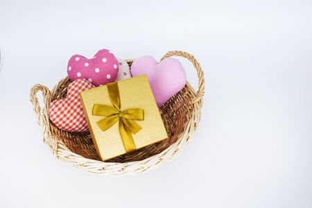 Gift basket and hearts isolated on a white background. The concept of gifts and congratulations for the holidays. Copy space.の写真素材