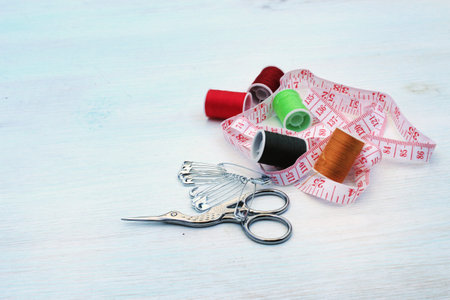 Needlework. Threads, scissors, tape measure. Materials for creative work. Female hobbies concept....