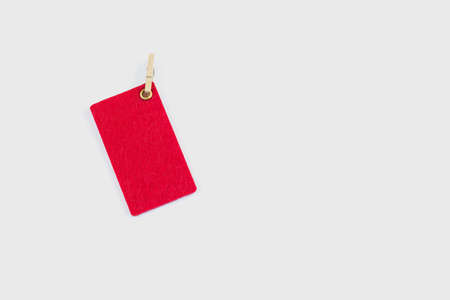 Red tag. Label. Colorful tag or label isolated on white background. Close-up. Copy space.の写真素材