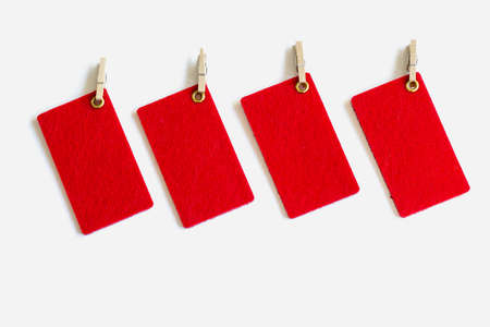 Red tag. Label. Colorful tag or label isolated on white background. Close-up. Copy space.の写真素材