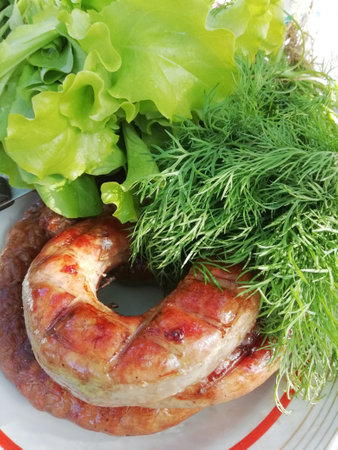 Grilled sausage and lettuce. Picnic and barbecue. outdoor food. flat layout. top view.の写真素材