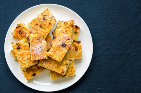 Homemade cottage cheese casseroles with raisins on a white background. Healthy food, natural...