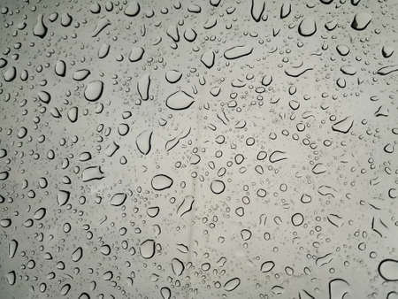 Natural water drops on glass. Background. Close upの写真素材