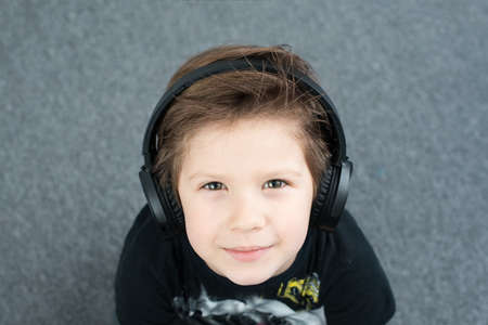 bhandsome boy in headphones listening to musicの写真素材