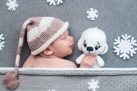 Newborn baby sleeping on greyの写真素材