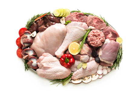 Different types of turkey meat and chicken, steaks, carcass poultry for cooking, top view on a wooden board, isolate on a white background. Flat lay, cooking concept.の写真素材