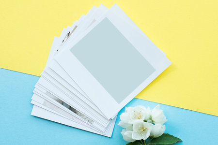 printed ,  cards, on a blue background with a white flower. Mock up.