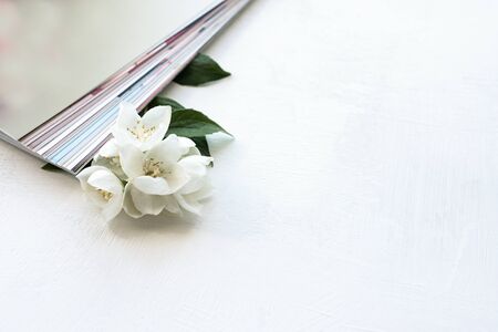 printed photos, cards, on a blue background with a white flower. Mock up.の写真素材