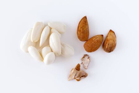 row, line of peeled young almonds on a white background, isolate, nut antioxidantの写真素材