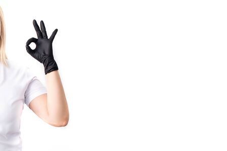 Doctor in a medical mask and green rubber gloves. Virus, coronavirus. protection. Sterile equipment for the medical and beauty industries. Copy space, place for text.の写真素材