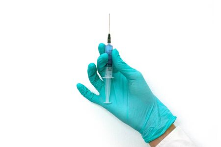 Hand in latex green medical protection gloves antibacterial vaccine. Coronavirus optimistic hygiene concept. Copy spaceの写真素材