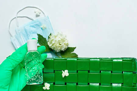 blue leather women bag with a medical mask, a sanitizer and gloves. Concept spring-summer 2020 exit...